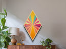 Sunshine Spectrum Pop Diamond Shaped Canvas Embossed Print with bold pastel starburst explosion midcentury vibes colorful retro geometric wall art