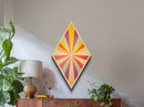 Pastel Radiance — Diamond Shaped Canvas Art Print brightens any playroom wall with sunshine burst design nursery decor colorful modern tones