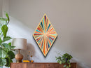 Colorburst Lines — Diamond Shaped Canvas Art Print makes a dramatic living room centerpiece with kinetic rainbow lines mid-century wall decor