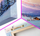 Snowy Cabin at Sunset Framed Canvas Print, Cozy Mountain Retreat with Snow-Covered Pines, Winter Landscape Art for Decor and Rustic Wall Art