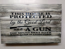 This House is Protected Hidden Gun Storage Sign