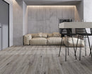SPC Vinyl Rigid Core 7" Width 60" RL, 6mm Thick, 1.5mm IXPE Keystone Grey, Invicta Floors - Mazzia Collection sitting couch view
