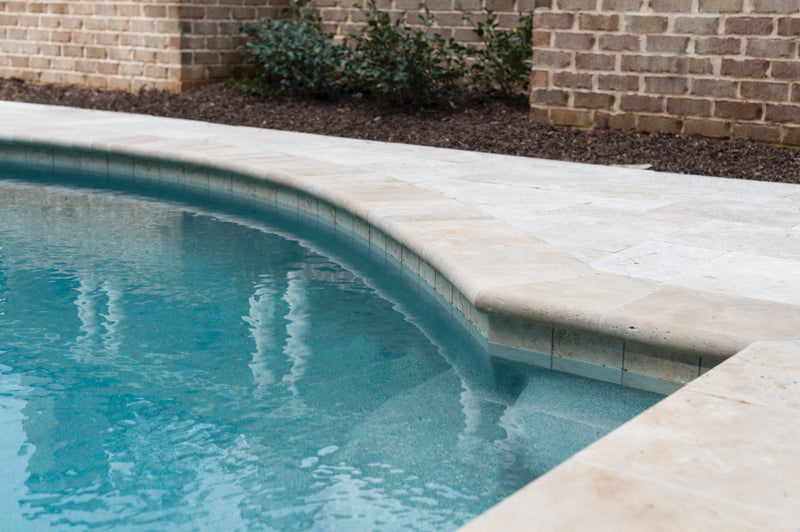 Tuscany Beige 16"x24" Brushed Travertine Pool Coping- Eased Edge - MSI Collection room shot outdoor pool view 2