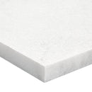 White foam mattress topper on a white background
