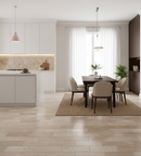 Modern kitchen and dining area with white cabinets, wooden floor, and pendant lights.