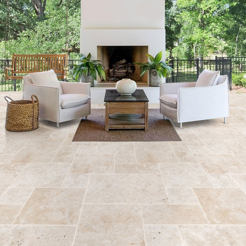 Miletos ivory travertine pavers unfilled tumbled pattern installed on patio fireplace view