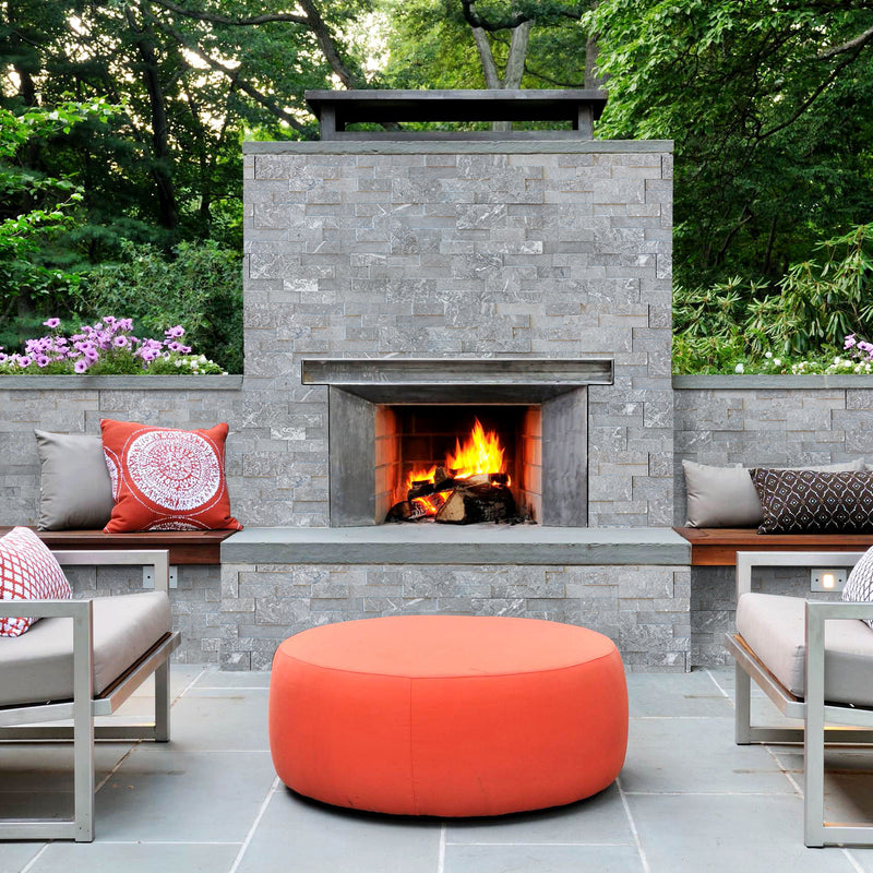 Moon Grey Ledger 3D Panel 6"x24" Natural Marble Wall Tile - Full Truckload   Honed installed around outdoor fireplace surround and walls red round coffee table and gray metal chairs