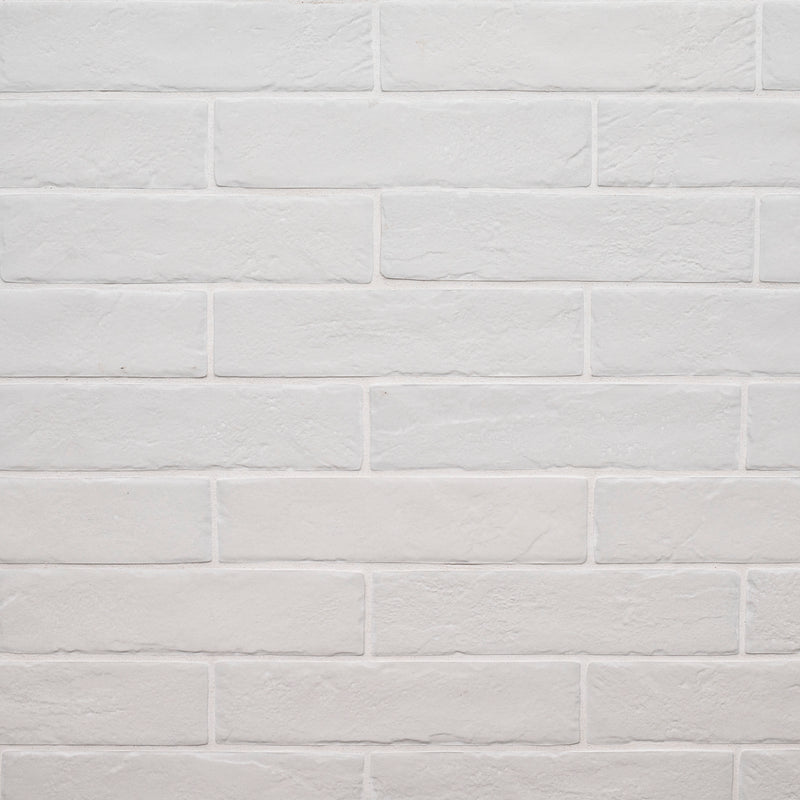 MSI brick collection capella white brick NCAPWHIBRI2X10 glazed porcelain floor wall tile product shot multiple bricks wall view