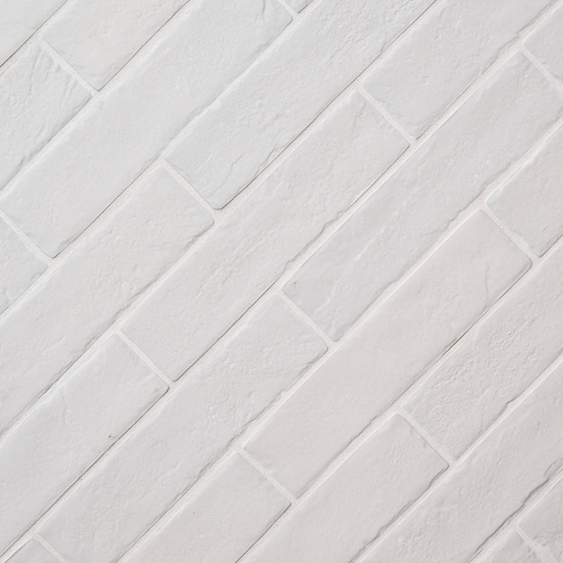 MSI brick collection capella white brick NCAPWHIBRI2X10 glazed porcelain floor wall tile product shot multiple bricks angle view