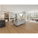 Modern living room with gray sofa, fireplace, and wooden floor. NS-18VH
