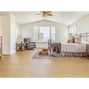 Spacious bedroom with a bed, armchair, and large windows. NS-21VH