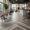 Modern cafe interior with wooden floor, tables, chairs, and a counter.