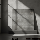 Concrete wall panel with a brand logo on a concrete floor with dumbbells.