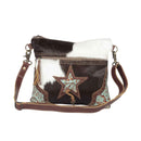 Myra North Star Bag for Women with hairon hide and embossed leather in black and white with adjustable detachable strap