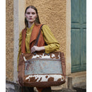 Myra Juniper Weekender Bag for Women with upcycled canvas and hairon hide with embossed leather detail