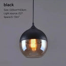 Amber glass and natural wood pendant light fixture for dining room