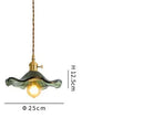 Blue translucent glass pendant lights with brass fixture bedroom