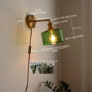 Green ribbed glass wall sconce with pull chain switch for bedroom
