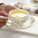 DecorBites™ Elegant Gold Flower Cup & Saucer Set - Delicate Porcelain Tea Coffee Mug