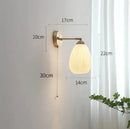 Vintage brass ceramic wall lamp with ribbed glass shade for bedroom