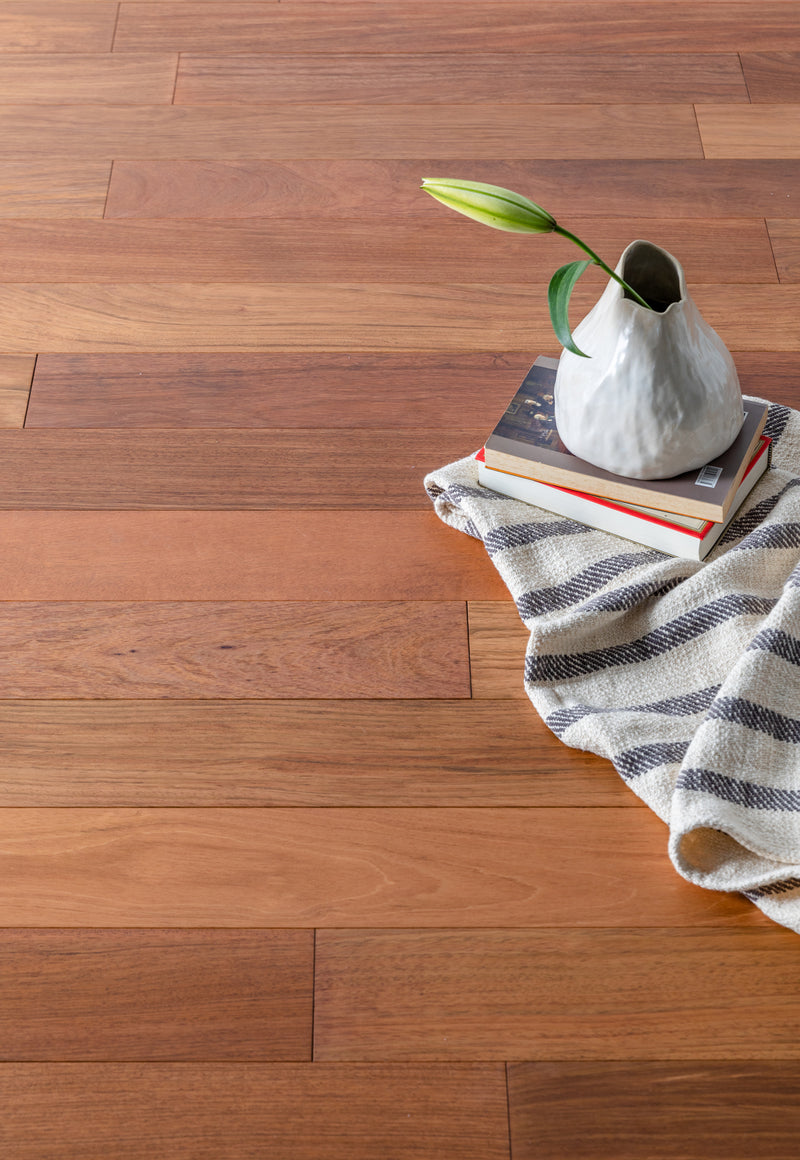 Solid Hardwood Prefinished Satin Mix Width, 84" RL, 3/4" Thick Smooth Brazilian Cherry Jatoba - Totem Collection books on floor view