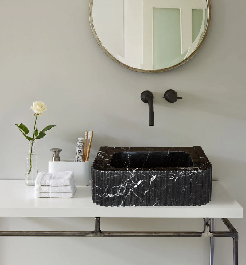 Toros Black Marble Rectangular Wall-mount Bathroom Sink Polished (W)12" (L)19" (H)7" bathroom above vanity rose inside glass vase and 3 white towels with 2 bamboo brushes