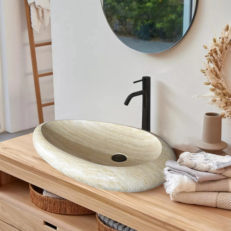 Troia Light Travertine teardrop shape vessel sink honed filled bathroom view above wood counter