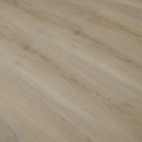 Close-up of a wooden surface with a light brown color and visible grain pattern.