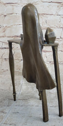 Disembodied Head Floating Over Table - Scary Surrealist Bronze Sculpture by Dali