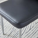 Table and chair set.Elegant Transparent Tempered Glass Dining Set - 71'x35.4' with 8 Black PU Chairs with a vertical stripe design on the backrest.