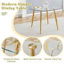 A modern minimalist style round transparent tempered glass table with gold metal legs, paired with 4 modern PU leather high-back dining chairs, bring a luxurious experience.