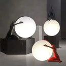Abstract black & red ball holding character resins lamp living room
