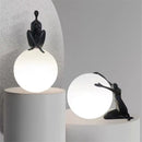 Abstract black & red ball holding character resins lamp living room
