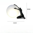 Abstract black & red ball holding character resins lamp living room