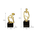Abstract golden hat thinker figure living room gold & black decor
