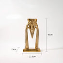 Abstract golden masked figure sculpture living room decor