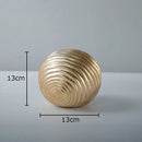 Abstract golden wave ball sculpture living room ribbed metal decor