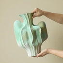Abstract mint & olive ceramic vase with irregular folds living room
