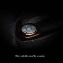 Mini controller near the armrests on a dark background