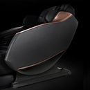 Black massage chair with rose gold accents on a black background