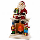 Santa Sitting on a Fireplace LED Lights Figurine 7.75 Inches