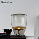 Amber glass and brass led table lamp for bedroom lighting