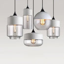 Amber glass and natural wood pendant light fixture for dining room