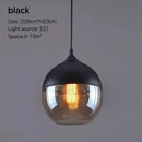 Amber glass and natural wood pendant light fixture for dining room