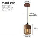 Amber glass and natural wood pendant light fixture for dining room