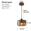 Amber glass and natural wood pendant light fixture for dining room