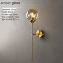 Amber glass ball sconce light brass finish bedroom wall lamp