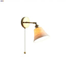 Antique brass and amber glass adjustable wall light bedroom sconce