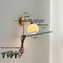 Antique brass and amber glass adjustable wall light bedroom sconce
