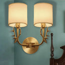 Antique brass antler wall sconce with fabric shade – bedroom light